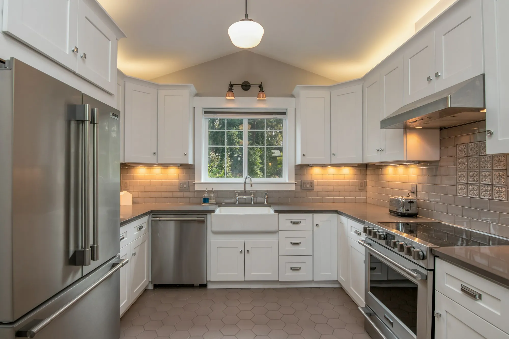 A kitchen with under-cabinet lighting