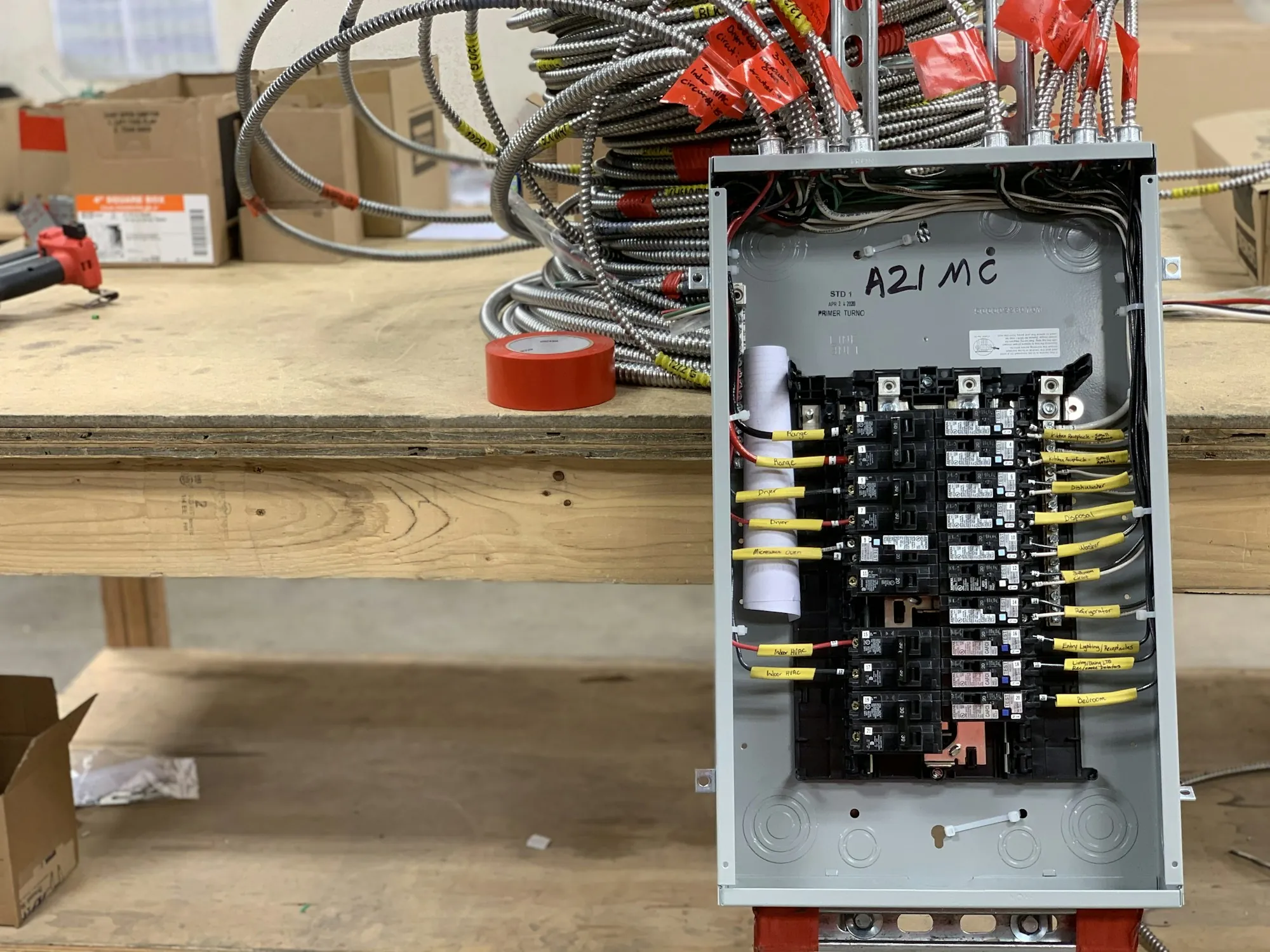 Breaker panel with its cover off, showing the wiring inside